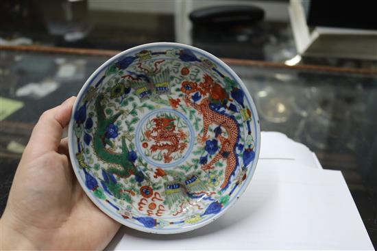 A Chinese wucai dragon and phoenix saucer dish, Kangxi mark, 19th century diameter 13.5cm